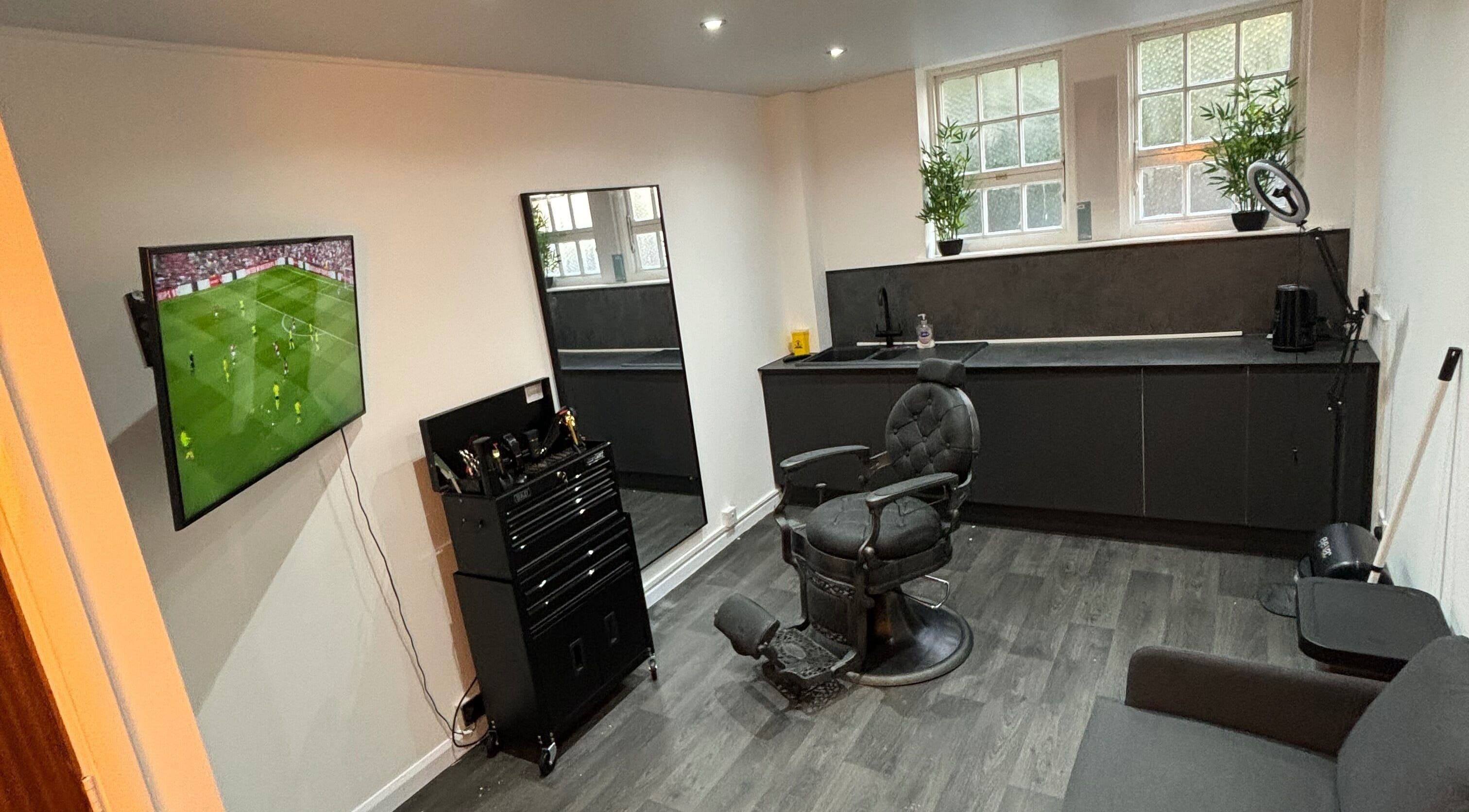 Modern barber chair setup in Snakebite Barbers, Hartlepool, England, GB featuring sleek interiors.