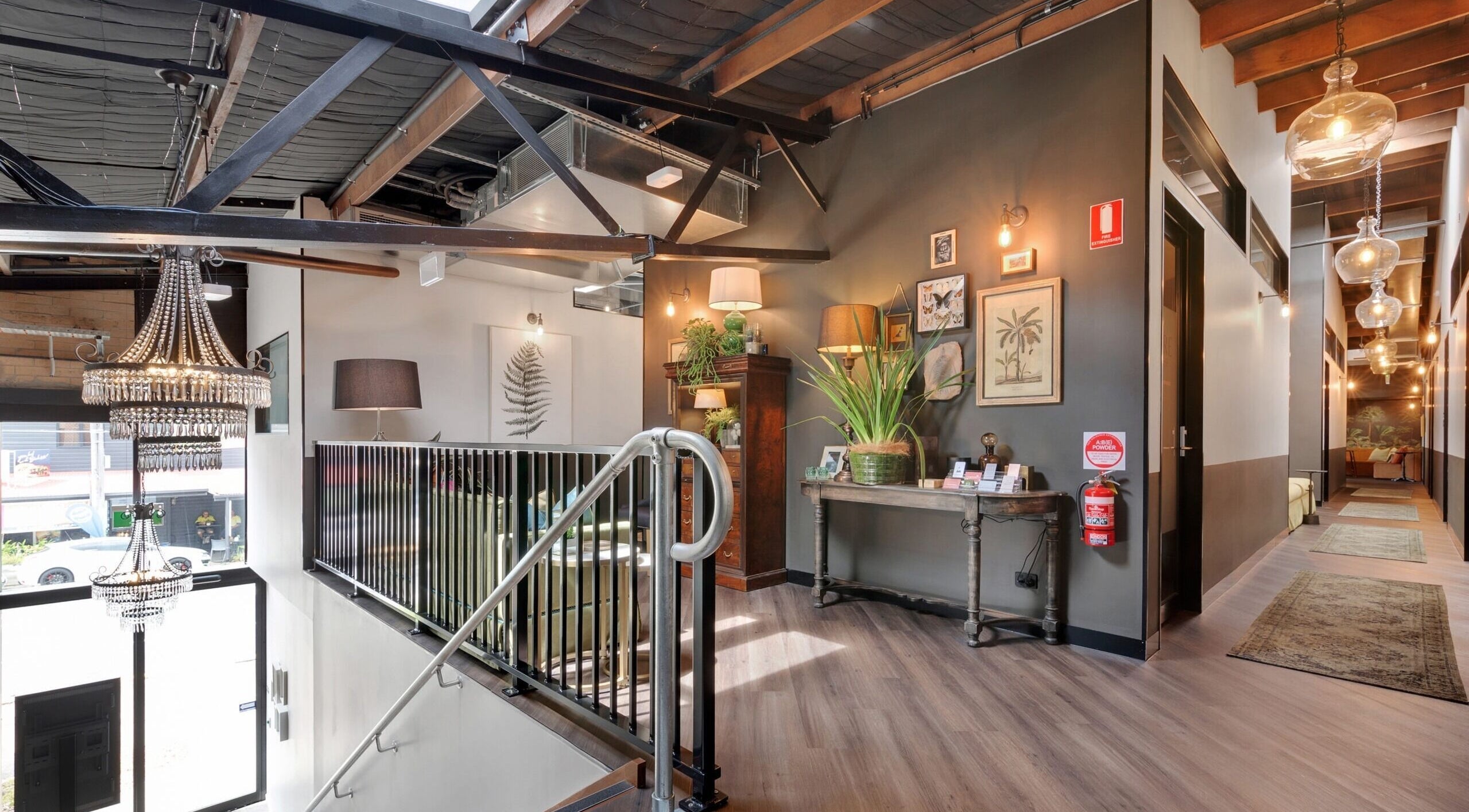 Cozy interior of Studio D.E.W on West End, Queensland, AU with vintage decor and lush plants.