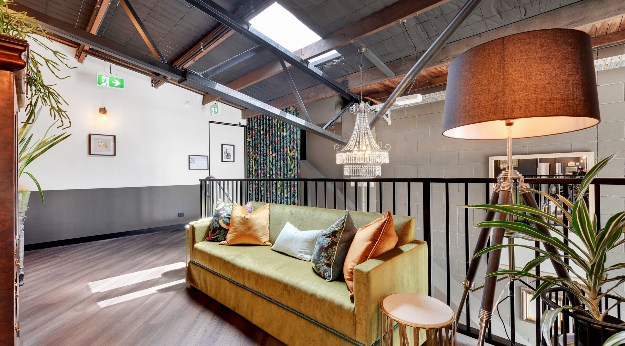 Chic loft with chandelier at Studio D.E.W, West End, Queensland, AU featuring a stylish couch and decor.