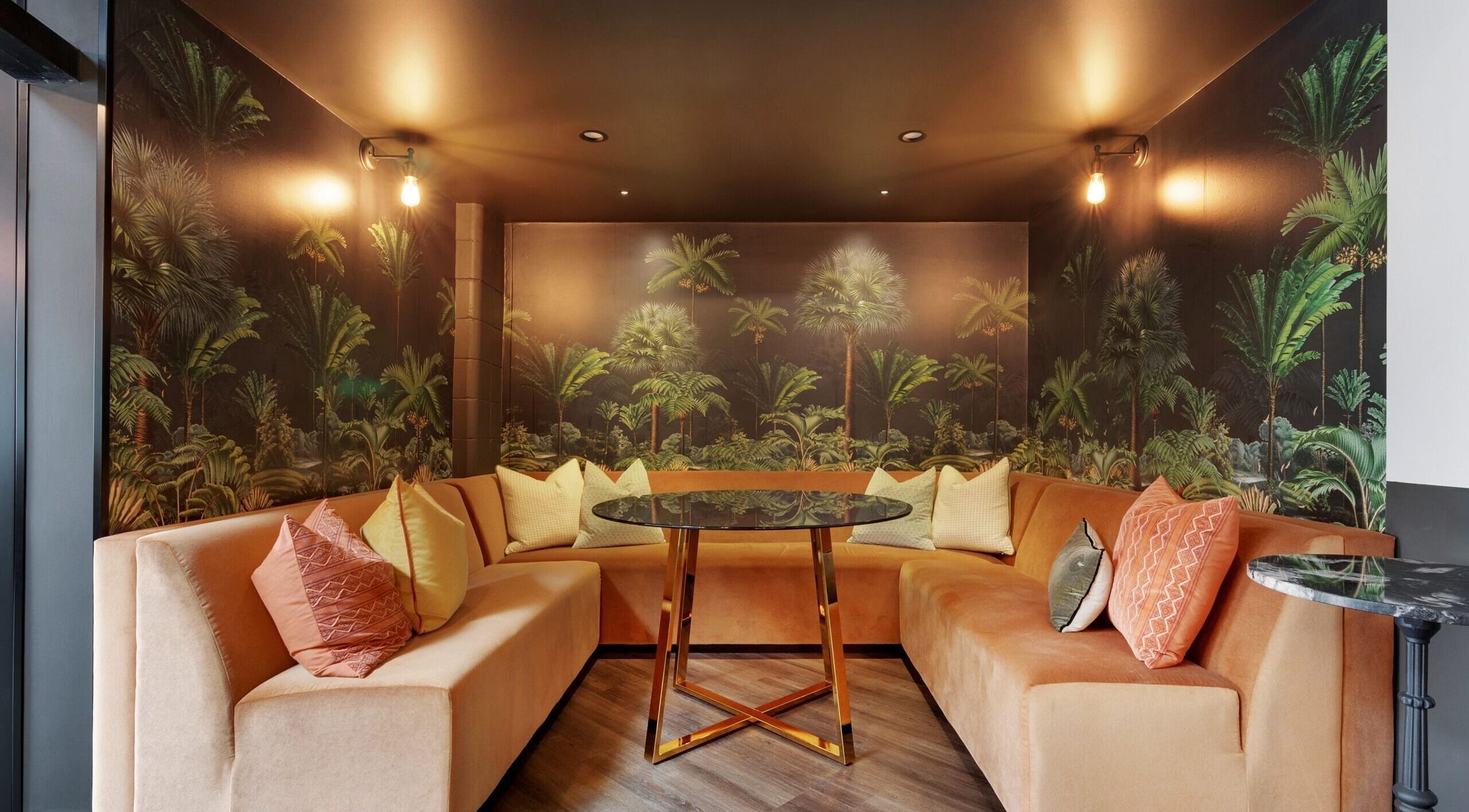 Elegant lounge area with palm wallpaper at Studio D.E.W in West End, Queensland, AU.