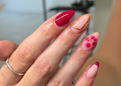 Elegant nail art at BeautyByIz, Bramley, England, GB. Features red and pink designs.