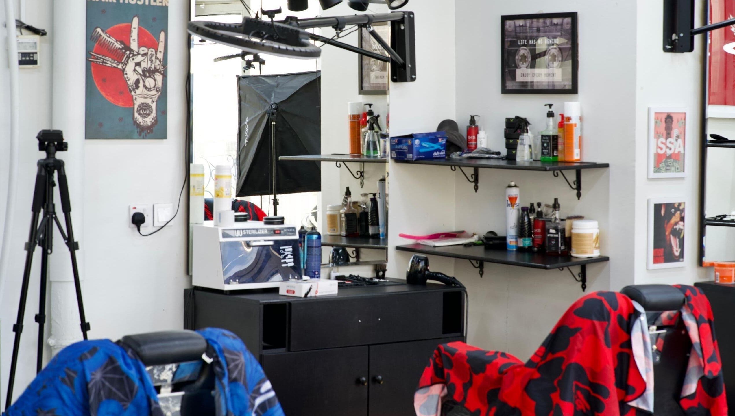 Barber shop interior at Faded in الخبر, المنطقة الشرقية, SA with styling chairs and products.