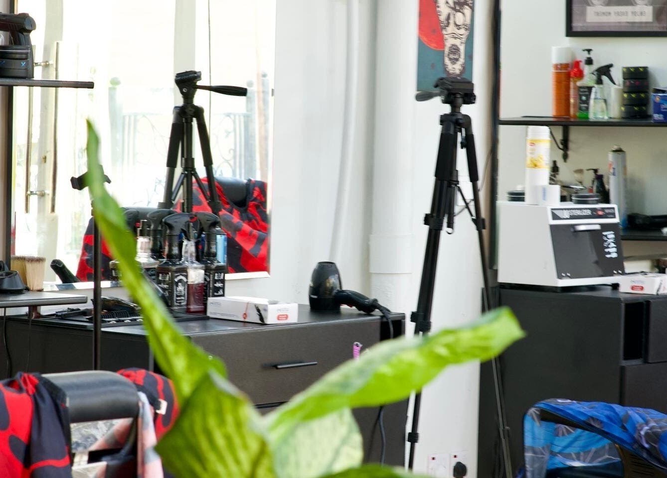 Modern salon interior at Faded in الخبر, المنطقة الشرقية, SA featuring styling tools and mirrors.