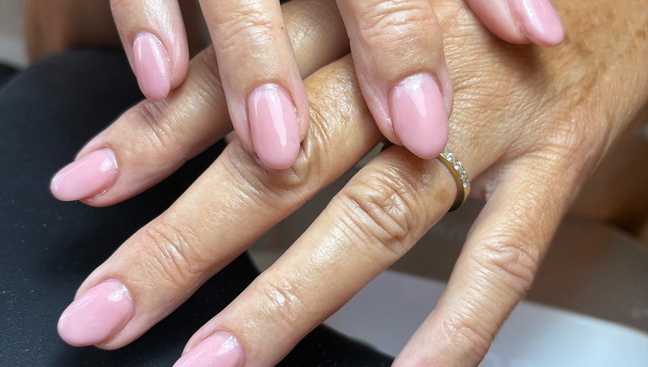 Close-up of elegant pink manicure at BeautyByJess, Sheffield, England, GB. Showcasing flawless nail care.