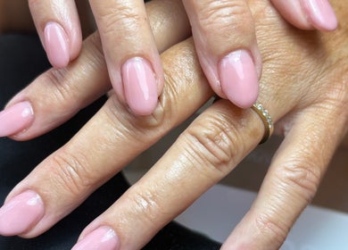 Close-up of elegant pink manicure at BeautyByJess, Sheffield, England, GB. Showcasing flawless nail care.