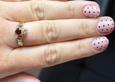 Stylish polka dot nail art at BeautyByJess, Sheffield, England. Elegant and trendy design.