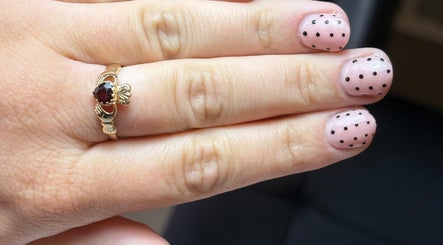 Stylish polka dot nail art at BeautyByJess, Sheffield, England. Elegant and trendy design.