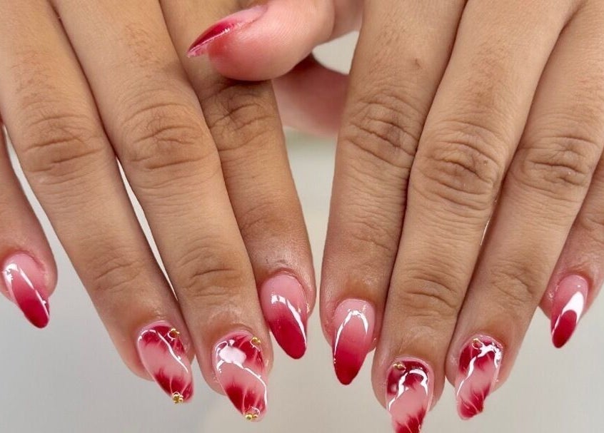 Stylish red gradient nails at Reign Lash and Brow, Georgetown, Demerara-mahaica, GY.