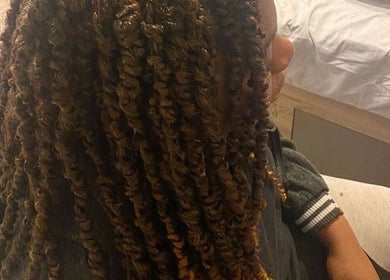 Intricate braided hairstyle at Beautcon, Seaton Delaval, England, GB, showcasing refined beauty and style.