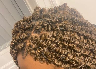 Close-up of stylish curly braids at Beautcon, Seaton Delaval, England, GB showcasing intricate detail.