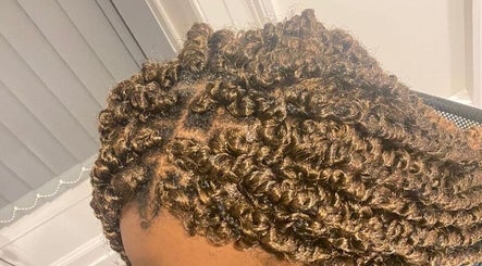Close-up of stylish curly braids at Beautcon, Seaton Delaval, England, GB showcasing intricate detail.
