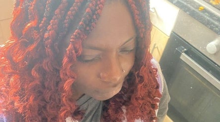 Stylish red curls at Beautcon, Seaton Delaval, England, GB, showcasing unique hair artistry.