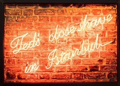 Bright neon sign on brick wall at Ted's Grooming Room: Marylebone - Duke Street, London, England, GB.