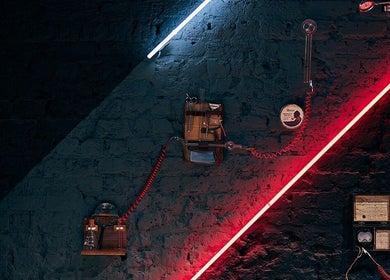 Modern grooming tools against neon-lit wall at Ted's Grooming Room: Baker Street - Dorset Street, London, England, GB.