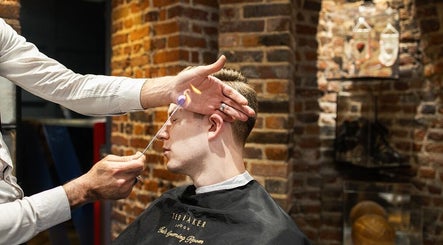 Precision grooming with flame technique at Ted's Grooming Room: Covent Garden - Great Queen Street, London, England, GB.