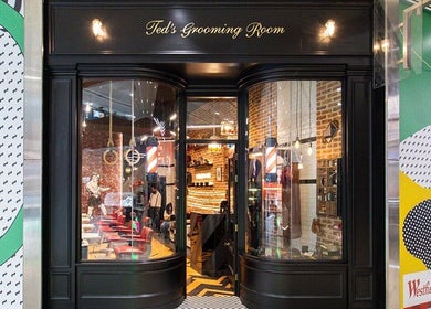 Entrance of Ted's Grooming Room: Westfield - Stratford in London, England, GB showcasing chic barber aesthetics.