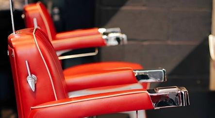Retro barber chairs at Ted's Grooming Room: Canary Wharf - Cabot Place, London, England, GB.