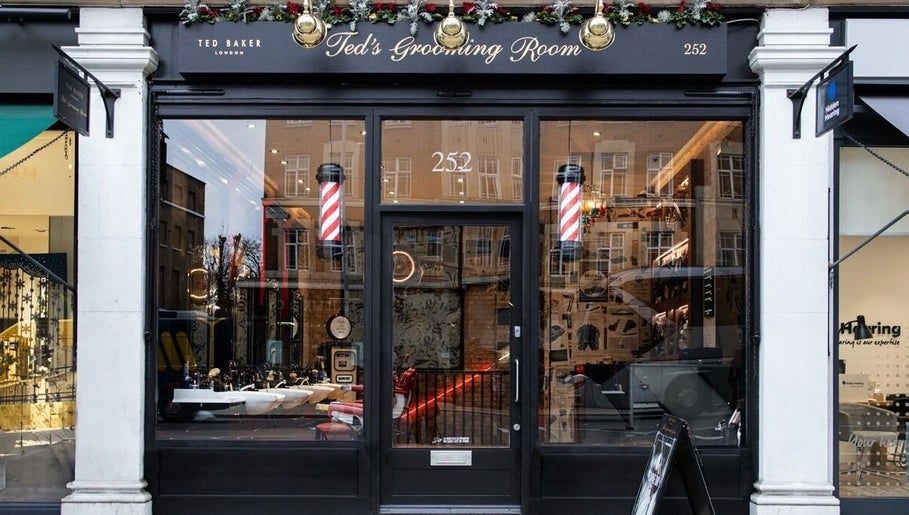 Elegant storefront of Ted's Grooming Room: Kensington - High Street in London, England, GB showcasing luxury grooming.