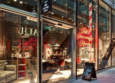 Exterior view of Ted's Grooming Room: Liverpool Street - Tower 42 in London, England, GB, showcasing chic design.