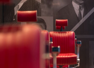 Vintage barber chair at Ted's Grooming Room: Liverpool Street - Tower 42, London, England, GB.