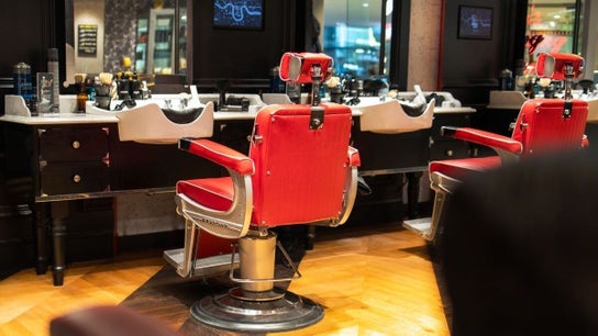 Barber chairs at Churchill Place - Canary Wharf, Ted's Grooming Room in London, England, GB.