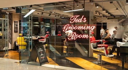 Interior of Ted's Grooming Room at Churchill Place - Canary Wharf, London, England, GB showcasing modern barbershop.