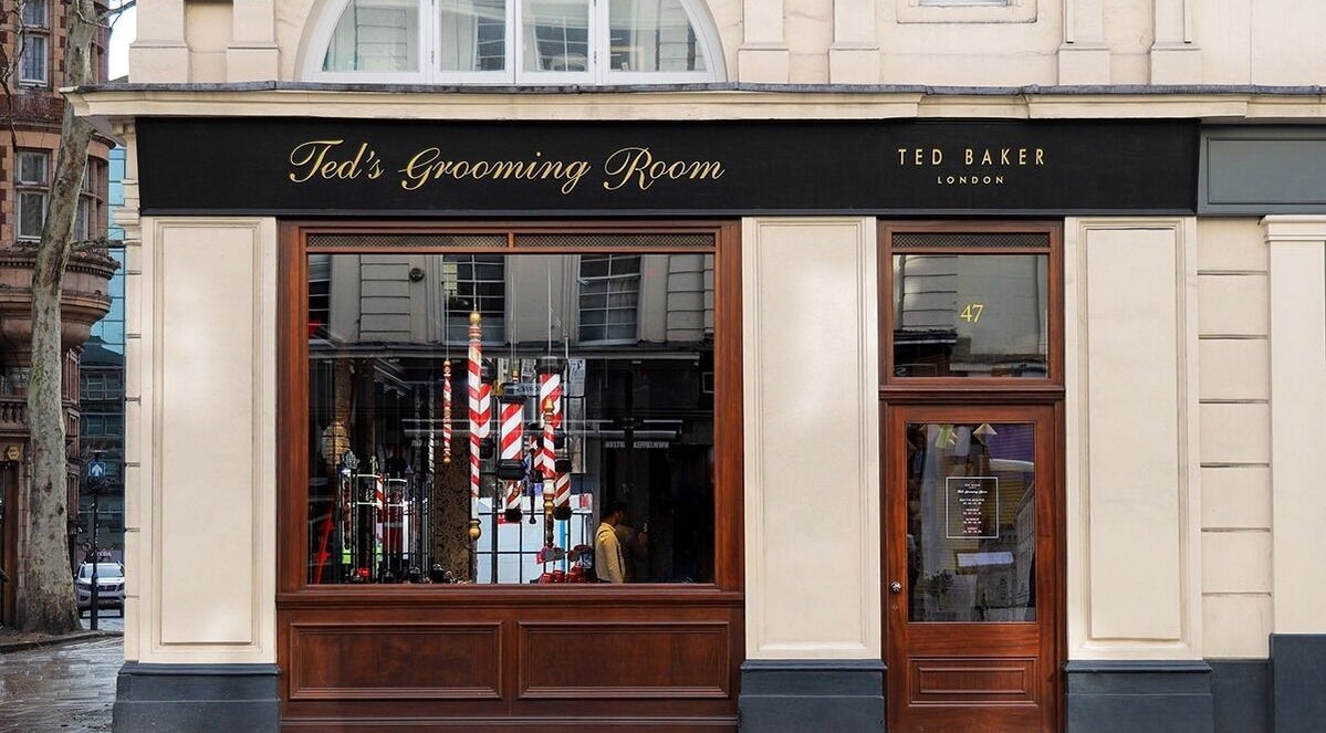 Exterior of Bloomsbury - New Oxford Street, Ted's Grooming Room in London, England, GB with elegant signage.