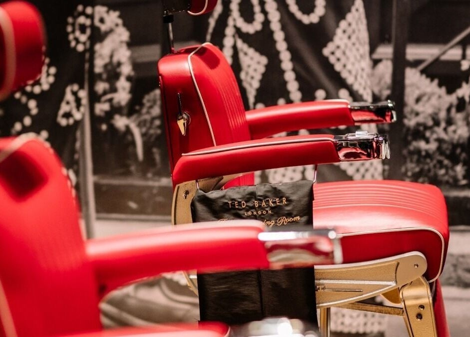 Red barber chairs at Ted's Grooming Room, One New Change - Bank, London, England, GB.