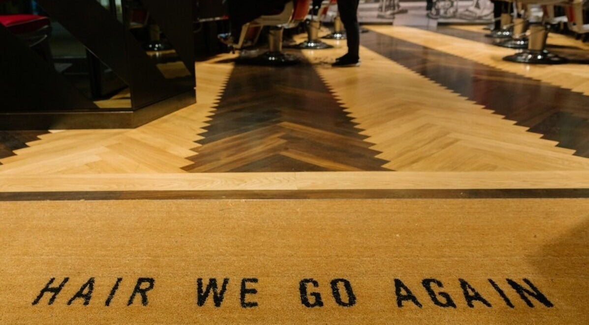 Stylish entrance mat at One New Change - Bank, Ted's Grooming Room, London, England, GB.