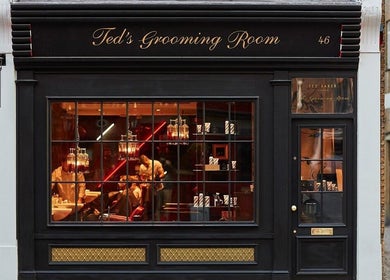 Front of Dorset - Baker Street, Ted's Grooming Room in London, England, GB with stylish dark exterior.