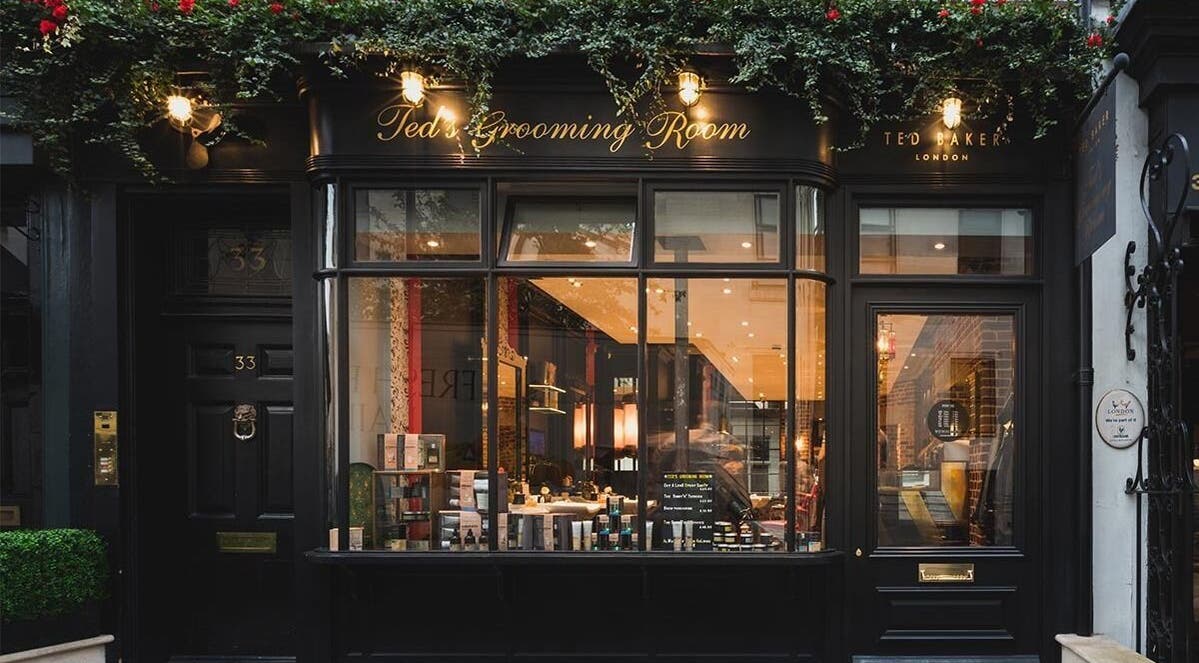 Exterior of Ted's Grooming Room on Great Queen Street, Covent Garden, London, England, showcasing elegant facade.