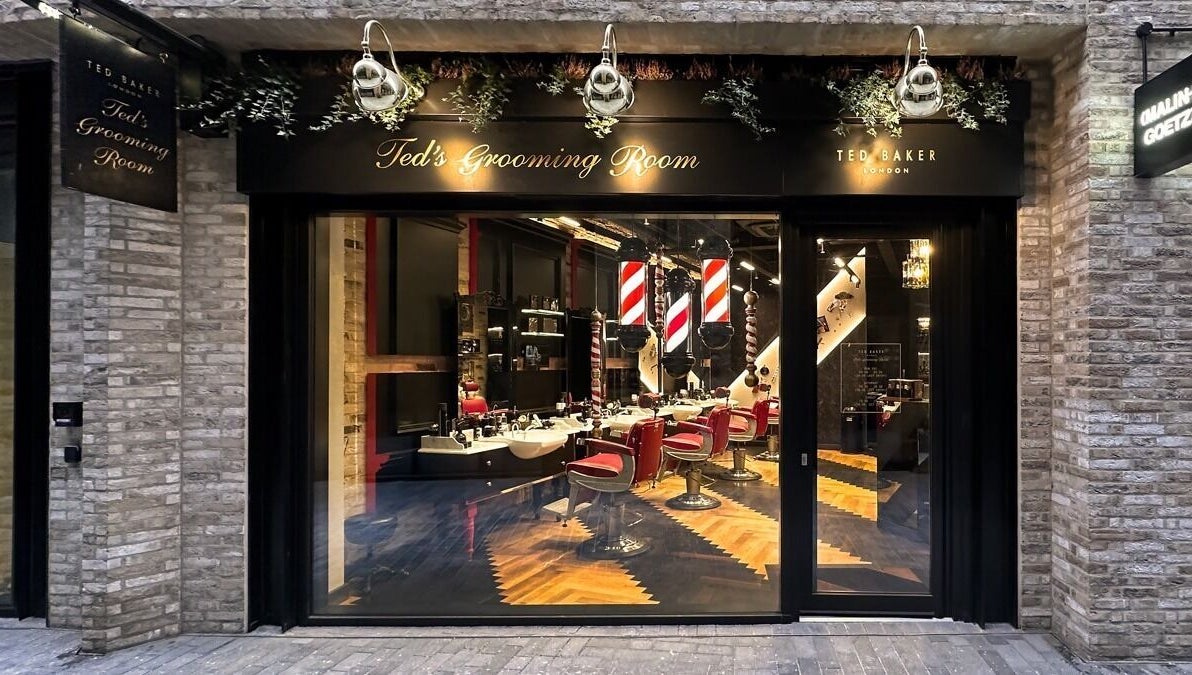 Exterior of Ted's Grooming Room in Borough Yards near London Bridge, London, England, GB, showcasing stylish interiors.