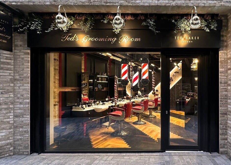 Exterior of Ted's Grooming Room in Borough Yards near London Bridge, London, England, GB, showcasing stylish interiors.