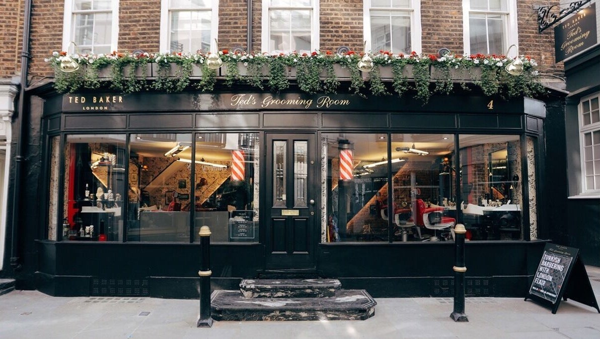 Exterior of Mayfair - Avery Row, Ted's Grooming Room in London, England, GB featuring elegant barber decor.