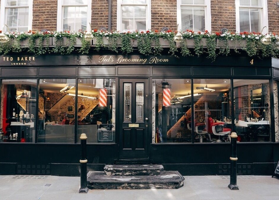 Exterior of Mayfair - Avery Row, Ted's Grooming Room in London, England, GB featuring elegant barber decor.