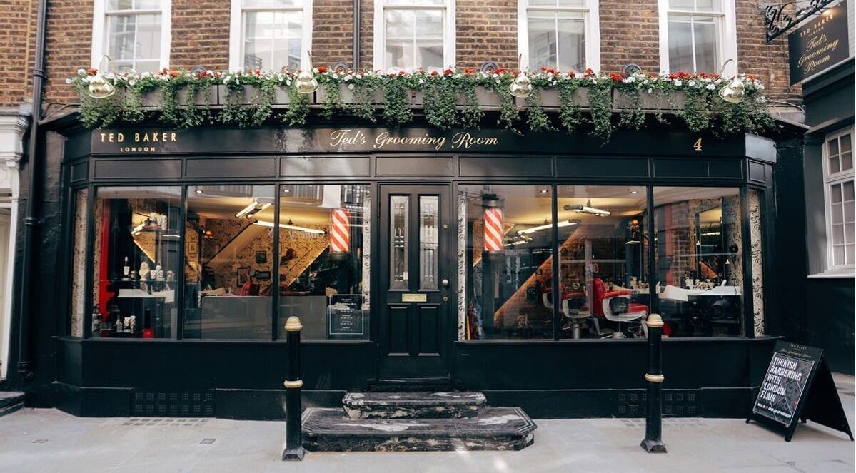 Exterior of Mayfair - Avery Row, Ted's Grooming Room in London, England, GB featuring elegant barber decor.