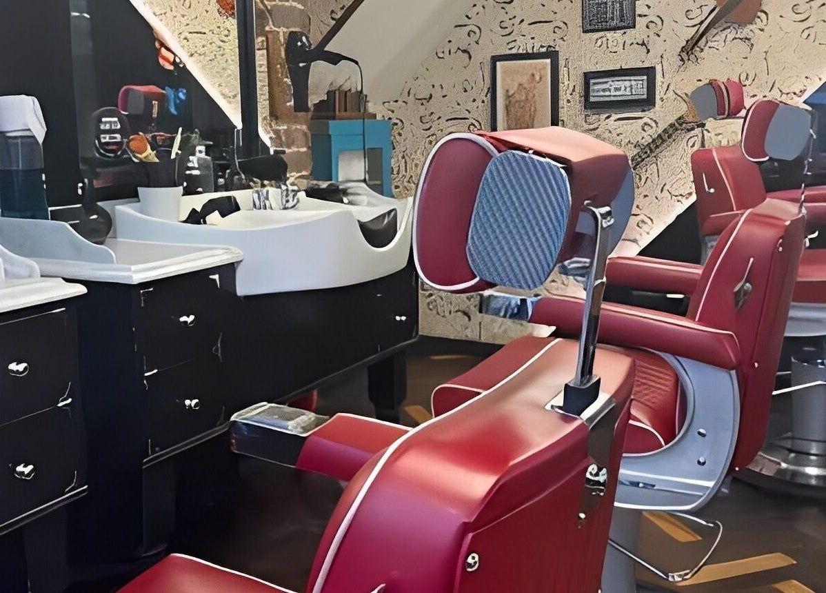 Modern setup at Mayfair - Avery Row, Ted's Grooming Room, London detailing red barber chairs and stations.