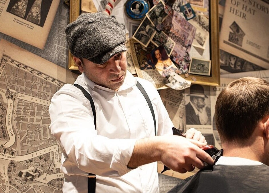 Barber at St. James's Park - Butler Place, Ted's Grooming Room in London, England, GB giving a haircut.