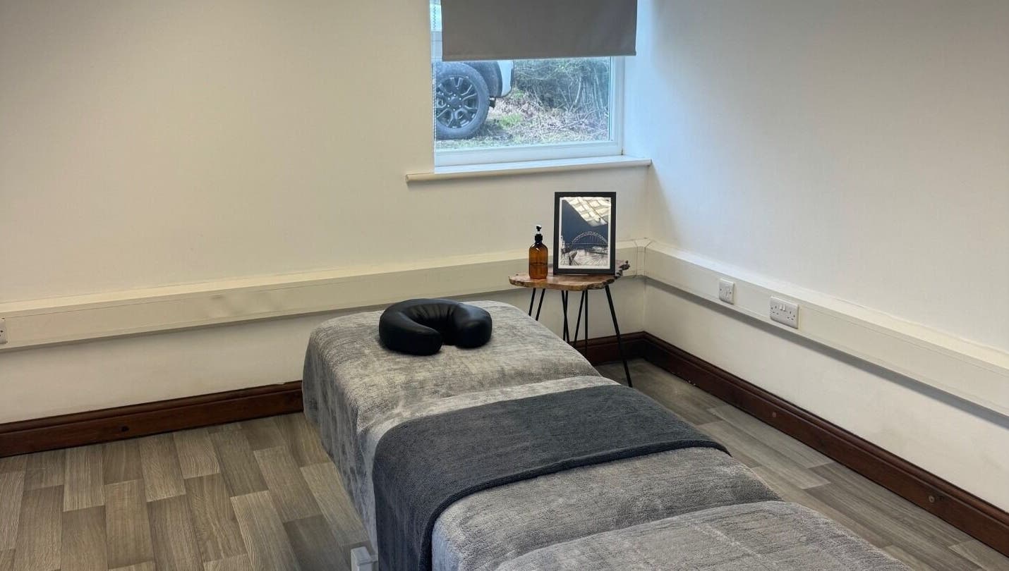 Calm massage room at Marley Massage, Colne, England, GB with a cozy massage table and serene decor.