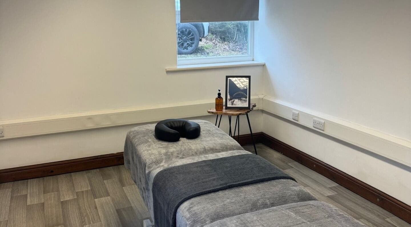 Calm massage room at Marley Massage, Colne, England, GB with a cozy massage table and serene decor.