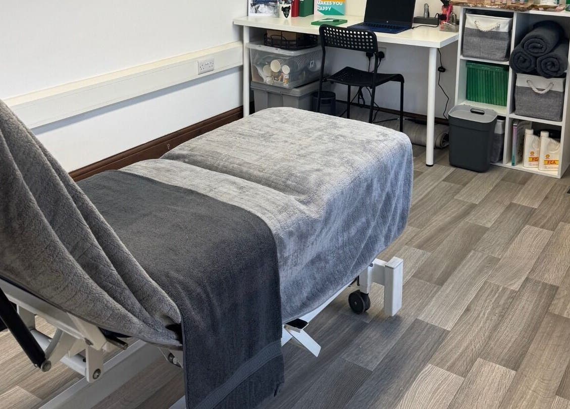 Relaxing massage room at Marley Massage, Colne, England, GB, featuring a comfortable massage bed and soothing decor.