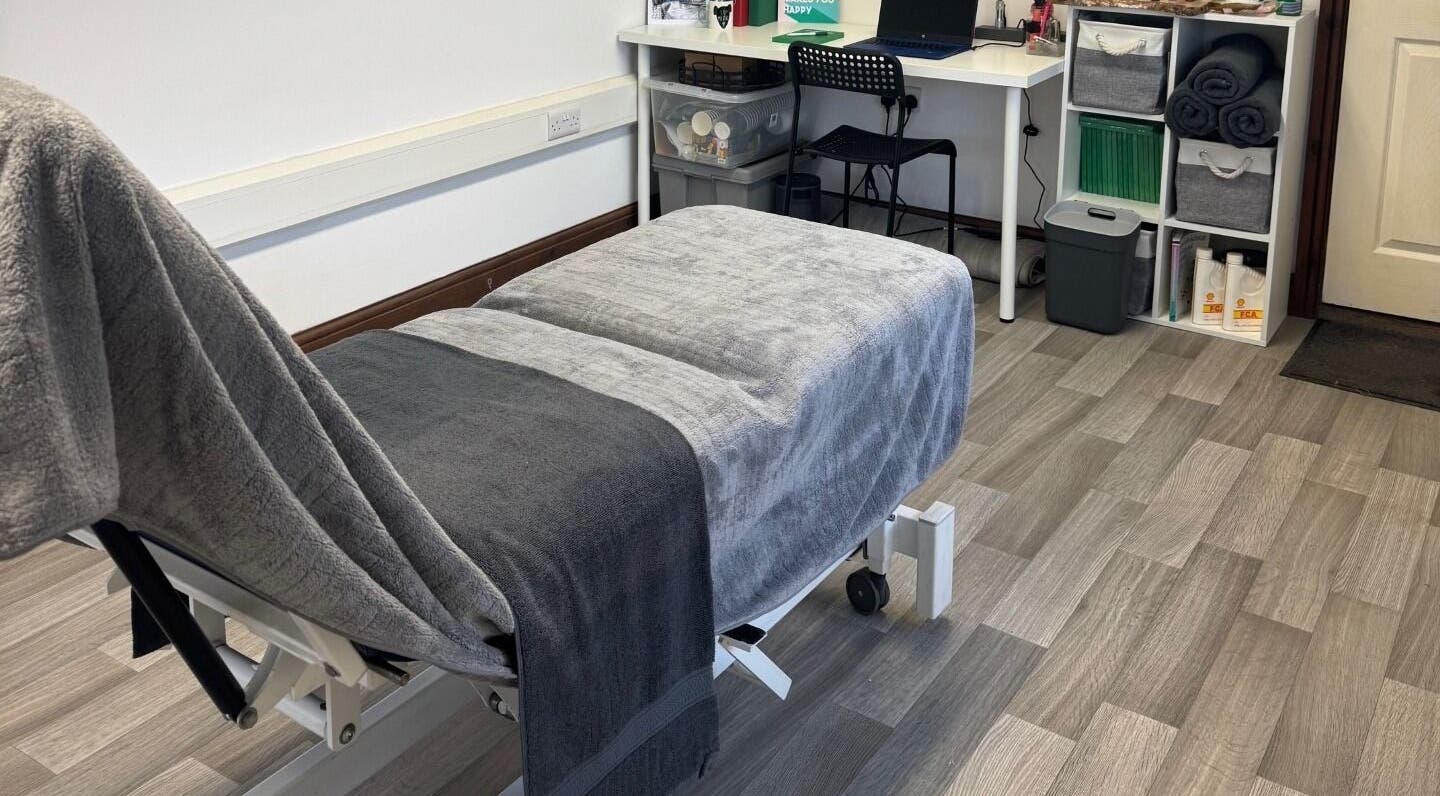 Relaxing massage room at Marley Massage, Colne, England, GB, featuring a comfortable massage bed and soothing decor.