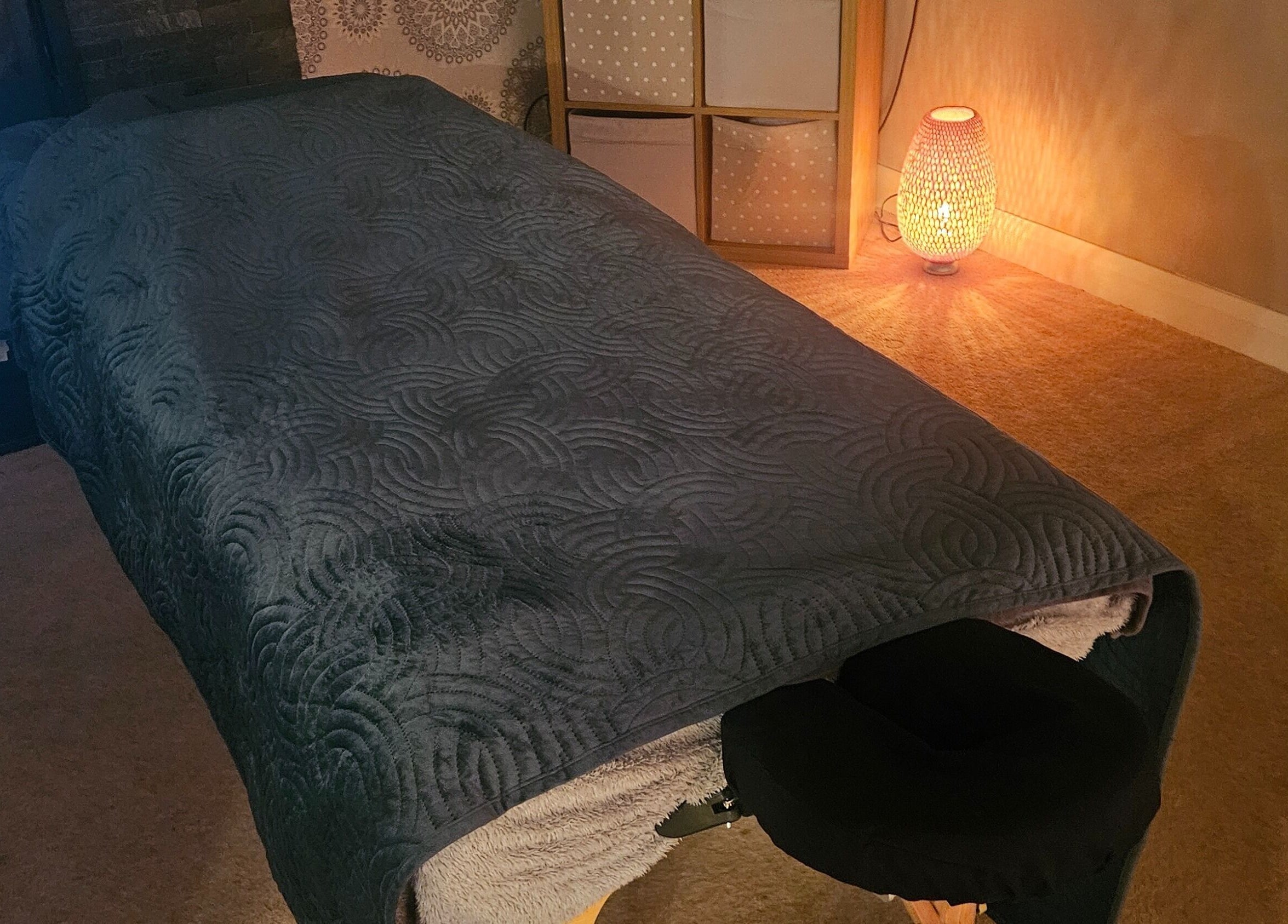 Relaxing massage room at Infinity Home Spa, Lurgan, Northern Ireland, GB, featuring a cozy treatment table.