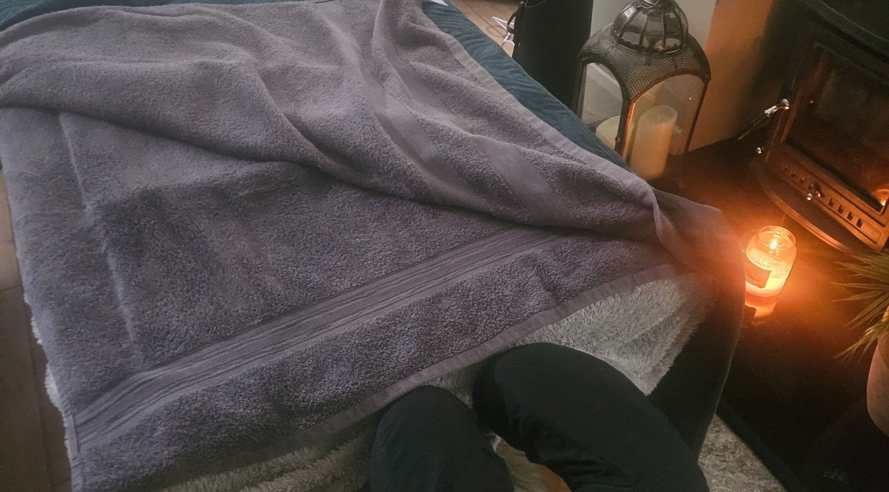 Soft towel and candlelit ambiance at Infinity Home Spa, Lurgan, Northern Ireland, GB.