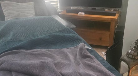 Cozy spa bed at Infinity Home Spa, Lurgan, Northern Ireland, GB for a relaxing wellness experience.
