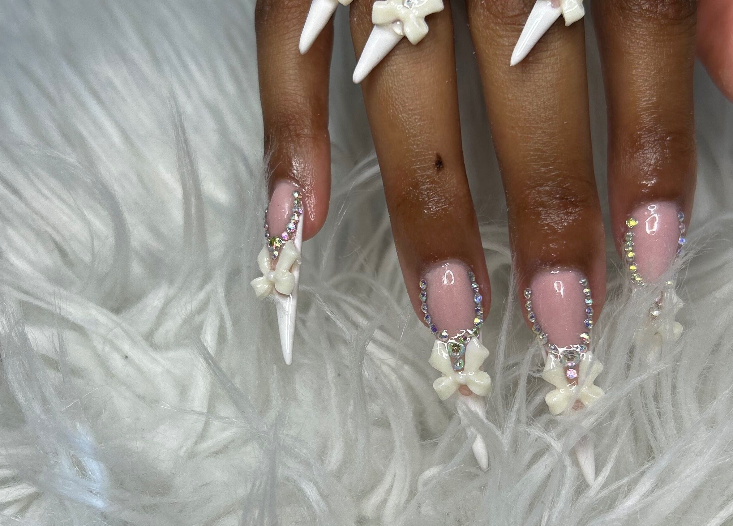 Intricate floral nail art with gems at FOCHVILLE, Fochville, Gauteng, ZA. Beauty and artistry meet in this unique design.
