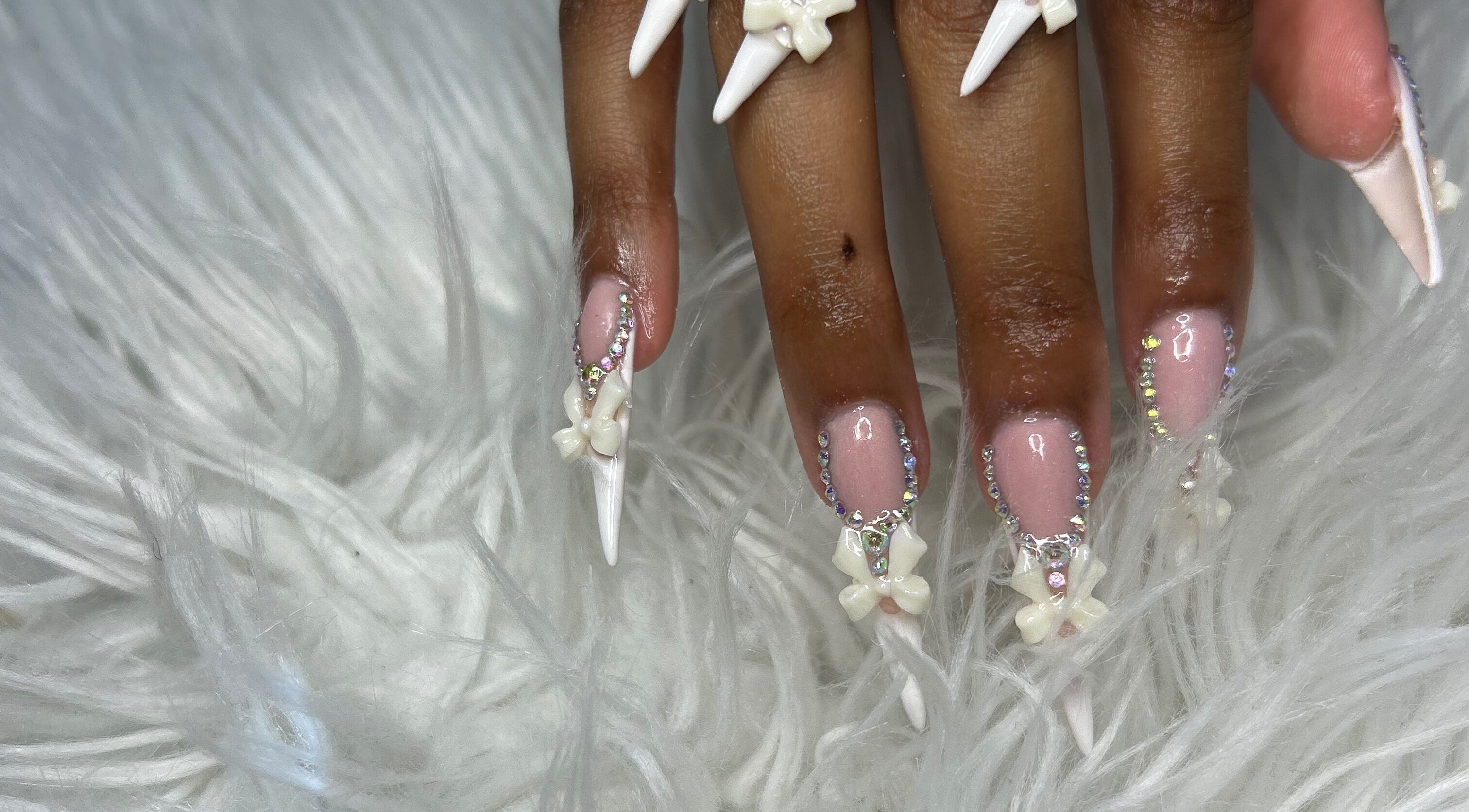 Intricate floral nail art with gems at FOCHVILLE, Fochville, Gauteng, ZA. Beauty and artistry meet in this unique design.