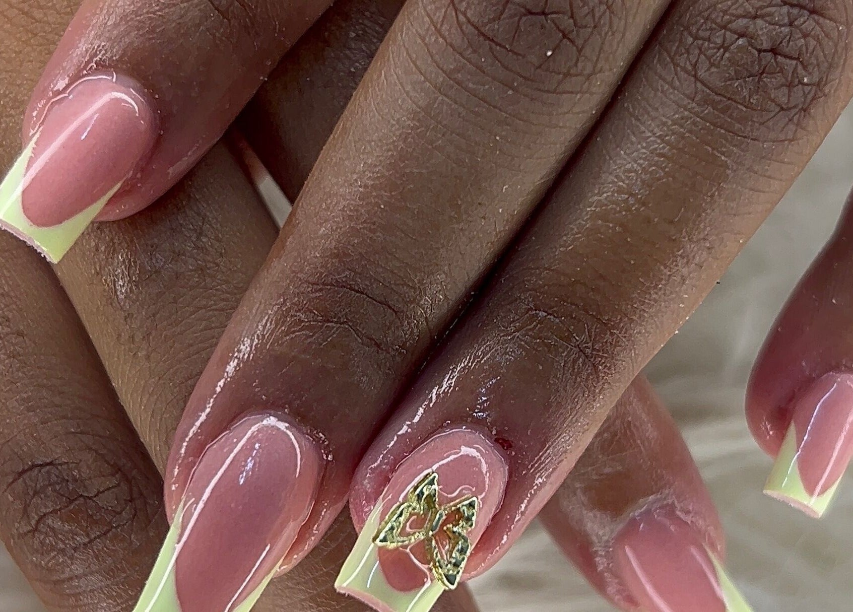 Manicure with pink and green design at FOCHVILLE, Fochville, Gauteng, ZA enhancing beauty and style.