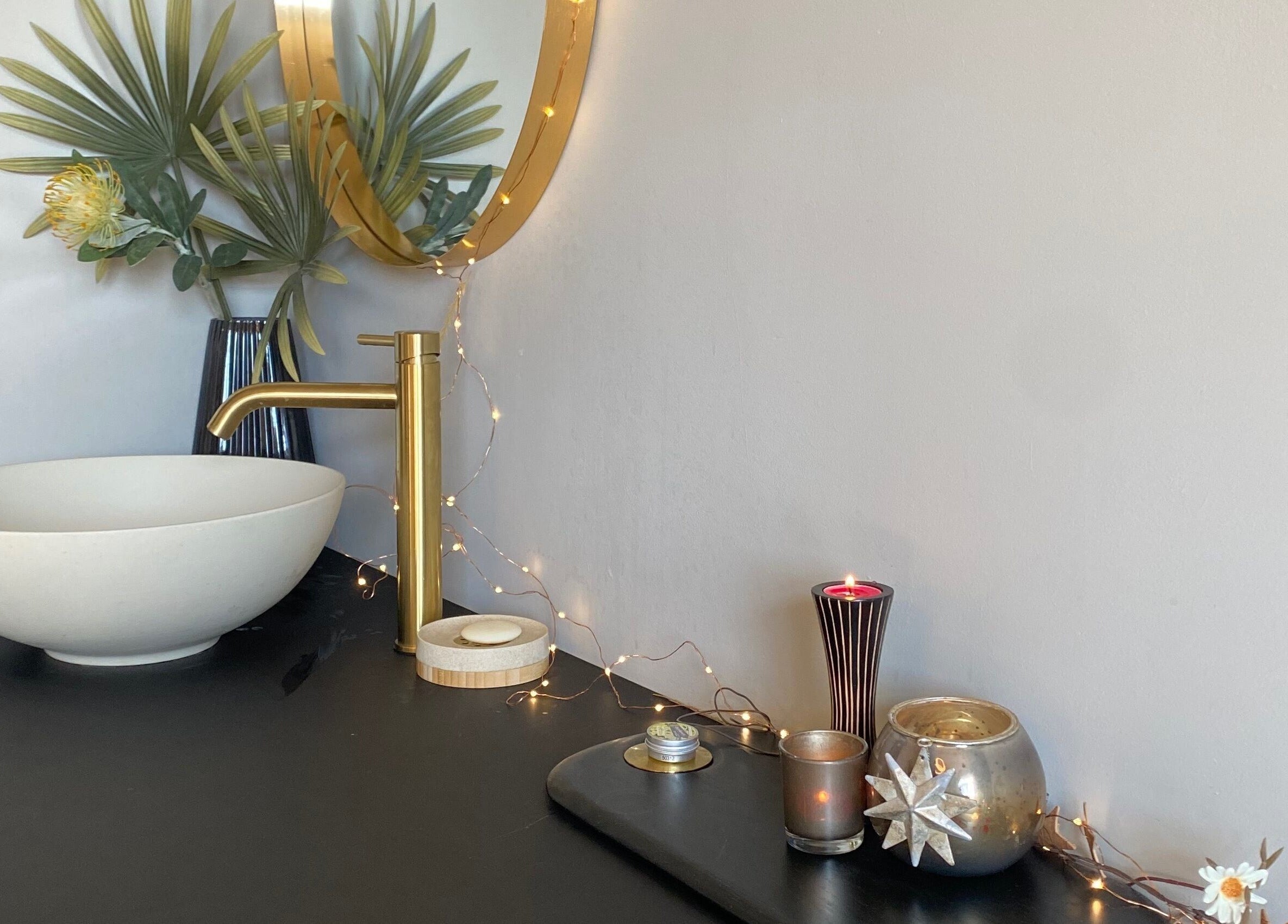 Elegant basin with decor at The Skin Refinery, Birmingham, England, GB, creates serene, inviting atmosphere.