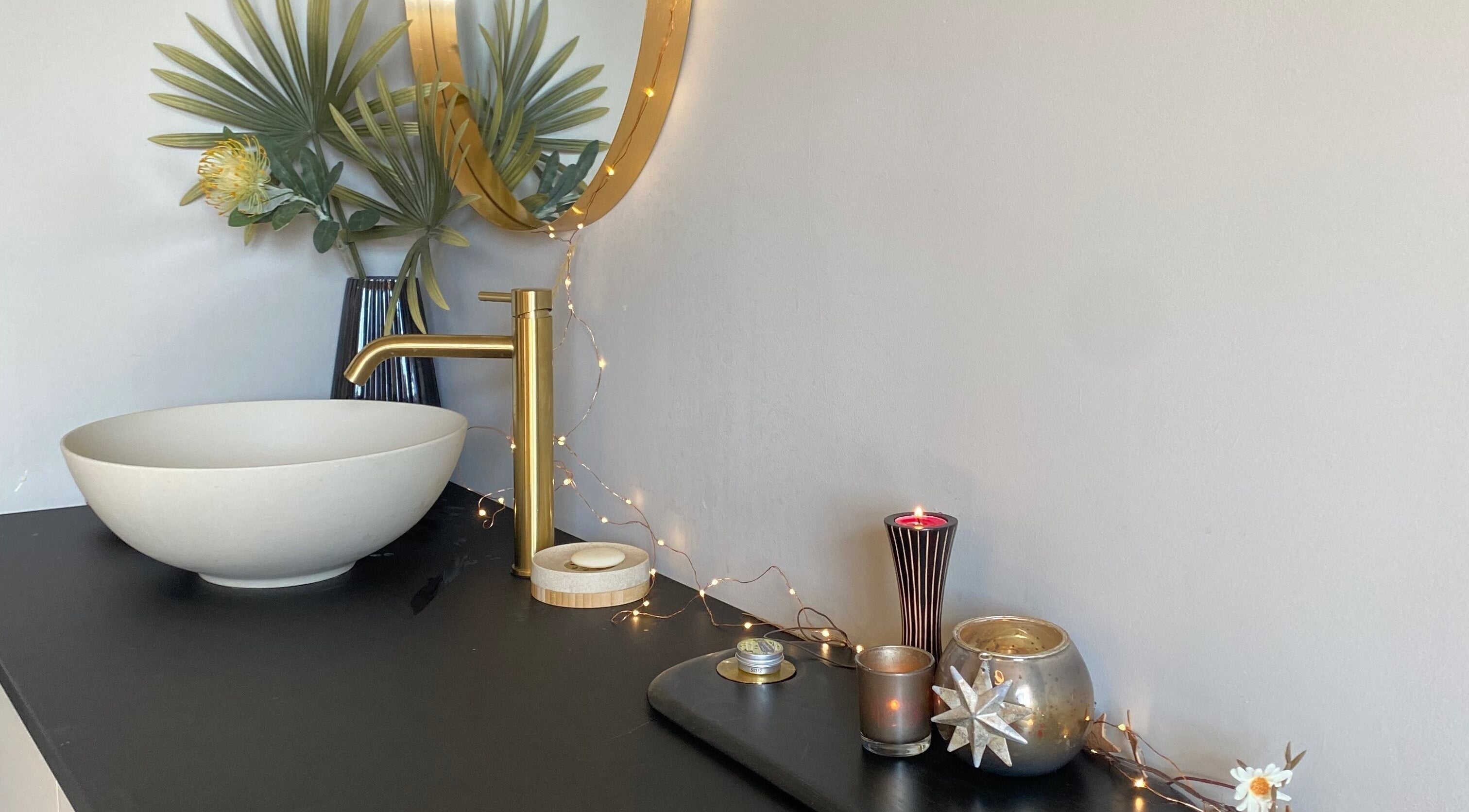 Elegant basin with decor at The Skin Refinery, Birmingham, England, GB, creates serene, inviting atmosphere.